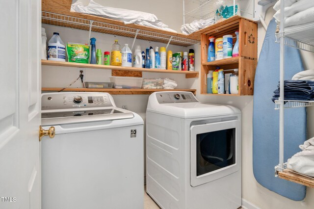 laundry room with washing machine and clothes dryer