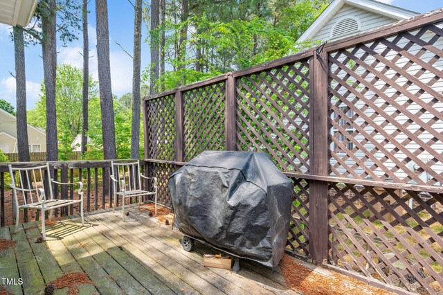 wooden deck featuring area for grilling