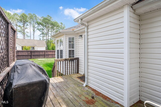 deck with grilling area and fence
