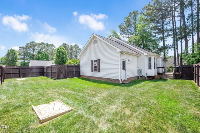 rear view of house featuring a deck
