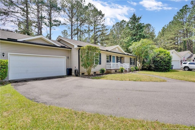 635 Chuckar Ct, Vass, NC 28394 - single story home featuring covered porch, an attached garage, crawl space, a front yard, and aphalt driveway