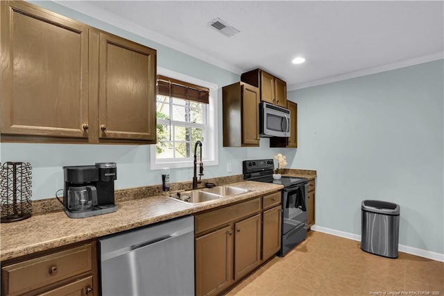 635 Chuckar Ct, Vass, NC 28394 - kitchen with a sink, stainless steel appliances, visible vents, crown molding, and baseboards