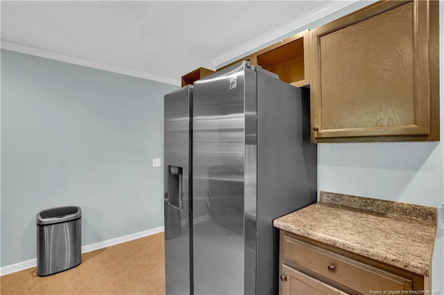 635 Chuckar Ct, Vass, NC 28394 - kitchen with baseboards, light tile patterned flooring, and stainless steel refrigerator with ice dispenser