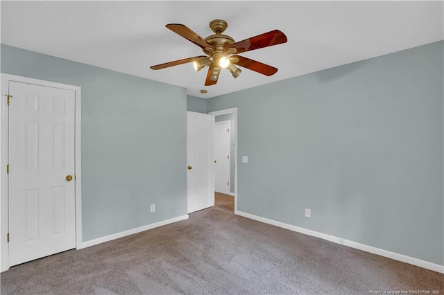 635 Chuckar Ct, Vass, NC 28394 - unfurnished bedroom with baseboards, a ceiling fan, and carpet
