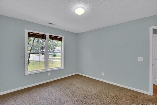 635 Chuckar Ct, Vass, NC 28394 - carpeted spare room featuring a textured ceiling, baseboards, and visible vents