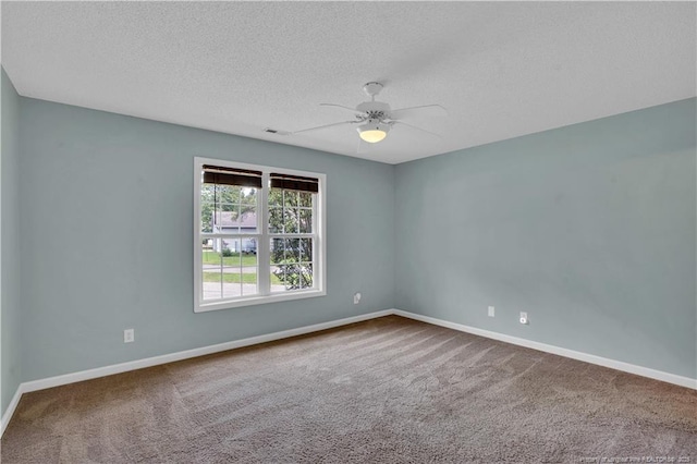 635 Chuckar Ct, Vass, NC 28394 - carpeted spare room with a textured ceiling, visible vents, baseboards, and a ceiling fan