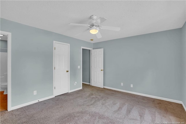 635 Chuckar Ct, Vass, NC 28394 - unfurnished bedroom featuring ensuite bathroom, a textured ceiling, carpet flooring, a ceiling fan, and baseboards