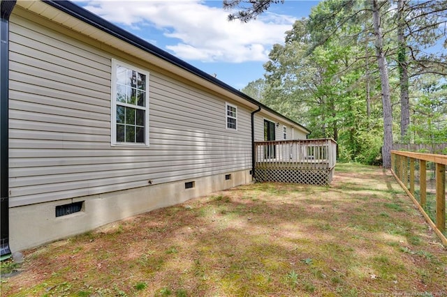 635 Chuckar Ct, Vass, NC 28394 - view of side of property featuring a lawn, a wooden deck, fence, and crawl space