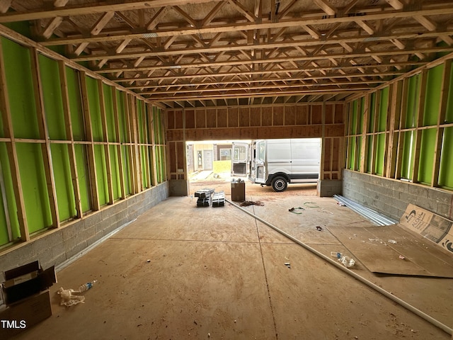 misc room with a garage