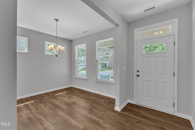 2100 Curry Meadow Way, Durham, NC 27703 - foyer entrance with a chandelier, dark wood-style flooring, baseboards, and healthy amount of natural light