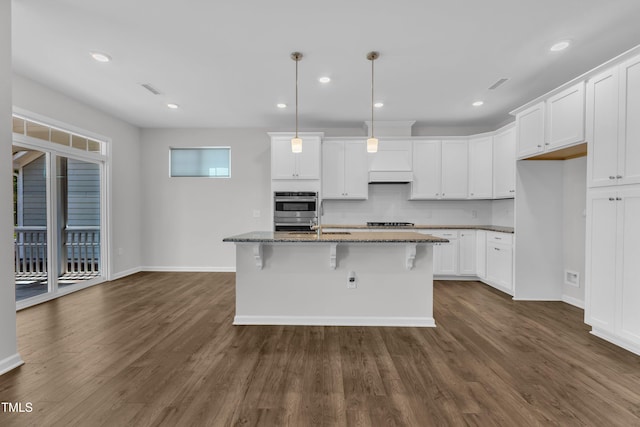 2100 Curry Meadow Way, Durham, NC 27703 - kitchen featuring dark stone countertops, baseboards, dark wood-style floors, appliances with stainless steel finishes, and recessed lighting
