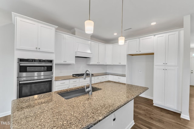 2100 Curry Meadow Way, Durham, NC 27703 - kitchen featuring a sink, stainless steel appliances, custom exhaust hood, white cabinets, and recessed lighting
