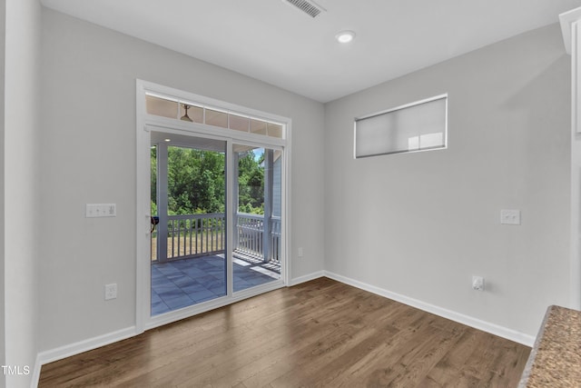2100 Curry Meadow Way, Durham, NC 27703 - unfurnished room with wood finished floors, baseboards, and recessed lighting