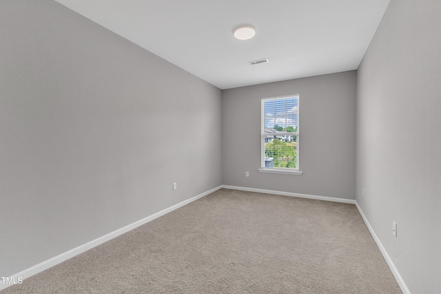 2100 Curry Meadow Way, Durham, NC 27703 - spare room with light colored carpet and baseboards
