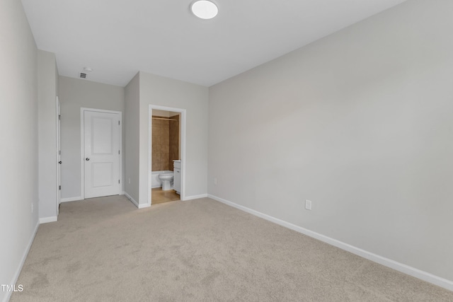 2100 Curry Meadow Way, Durham, NC 27703 - unfurnished bedroom with light carpet, baseboards, and ensuite bath