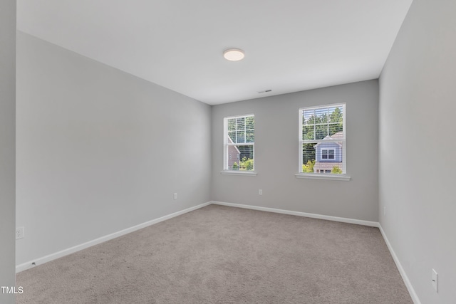 2100 Curry Meadow Way, Durham, NC 27703 - carpeted empty room with baseboards