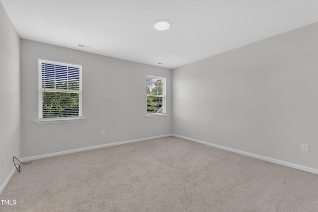 2100 Curry Meadow Way, Durham, NC 27703 - carpeted spare room featuring baseboards