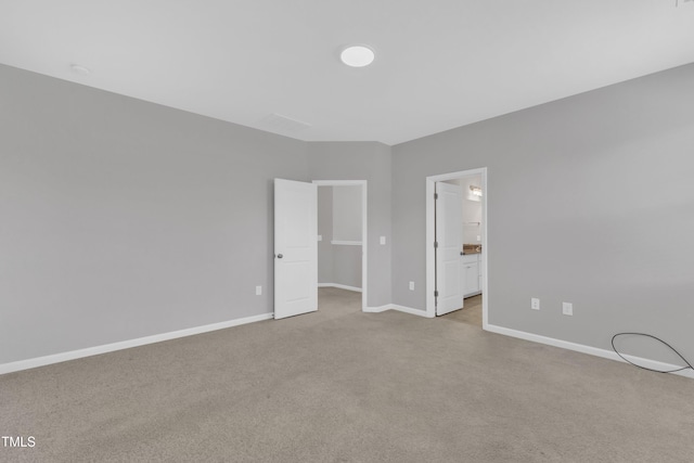 2100 Curry Meadow Way, Durham, NC 27703 - unfurnished bedroom featuring carpet flooring, baseboards, a spacious closet, and connected bathroom