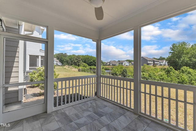 2100 Curry Meadow Way, Durham, NC 27703 - unfurnished sunroom with a ceiling fan, a residential view, and view of scattered trees