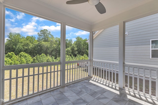 2100 Curry Meadow Way, Durham, NC 27703 - unfurnished sunroom featuring ceiling fan and view of wooded area