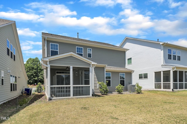 2100 Curry Meadow Way, Durham, NC 27703 - back of property featuring a sunroom and a lawn