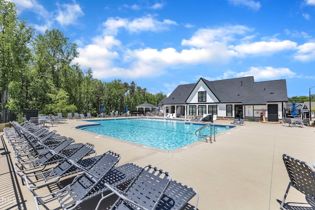 2100 Curry Meadow Way, Durham, NC 27703 - community pool featuring a patio area