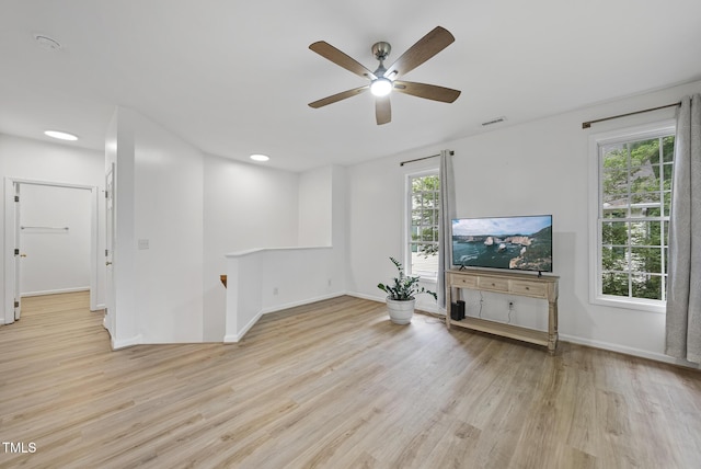 unfurnished living room featuring wood finished floors, plenty of natural light, ceiling fan, and recessed lighting