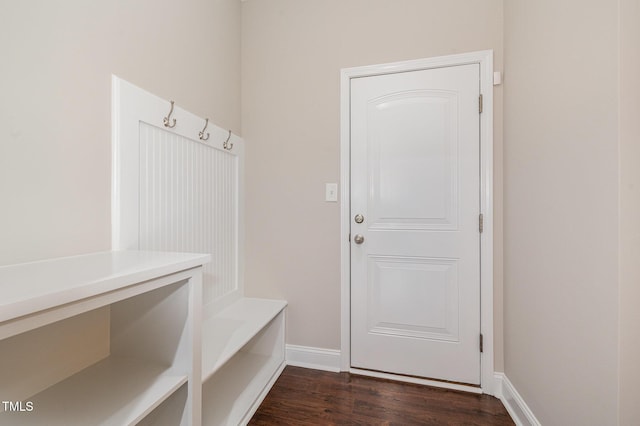mudroom with baseboards and dark wood-type flooring