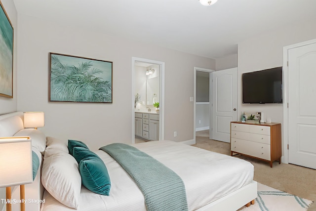 159 Gladstone St, Raeford, NC 28376 - bedroom with light colored carpet and ensuite bathroom