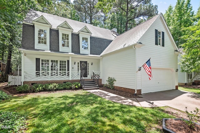 view of front facade featuring covered porch, a shingled roof, a front lawn, driveway, and an attached garage