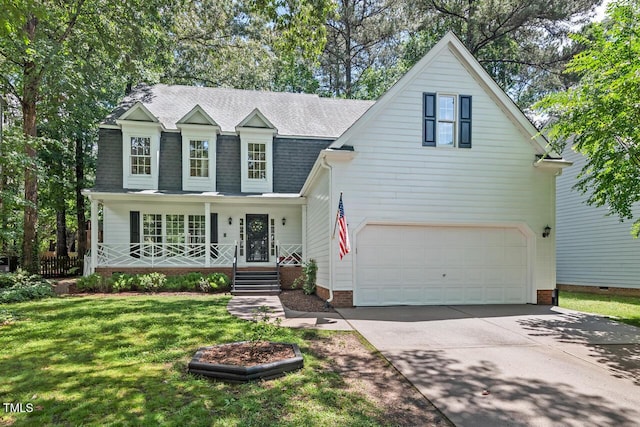 view of front of home with a porch, driveway, a front lawn, a garage, and roof with shingles