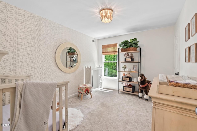 bedroom with carpet flooring and baseboards