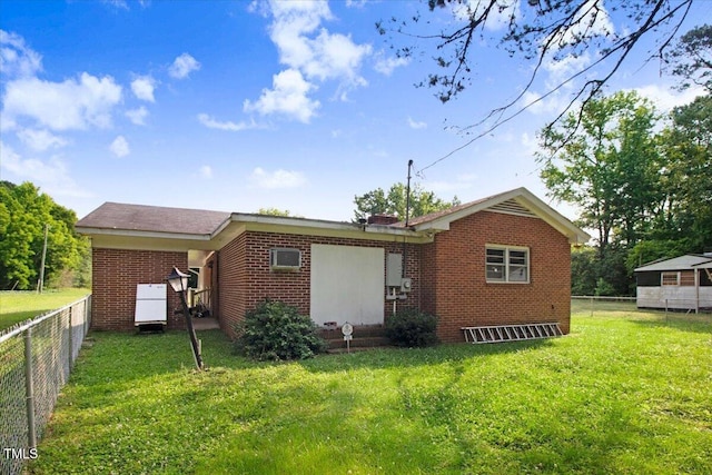 320 Dead End Rd, Enfield, NC 27823 - back of house featuring brick siding and a fenced backyard
