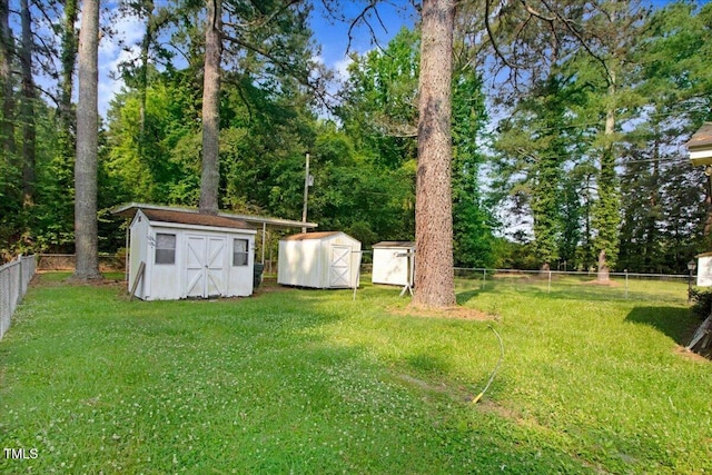 320 Dead End Rd, Enfield, NC 27823 - fenced backyard featuring a storage unit