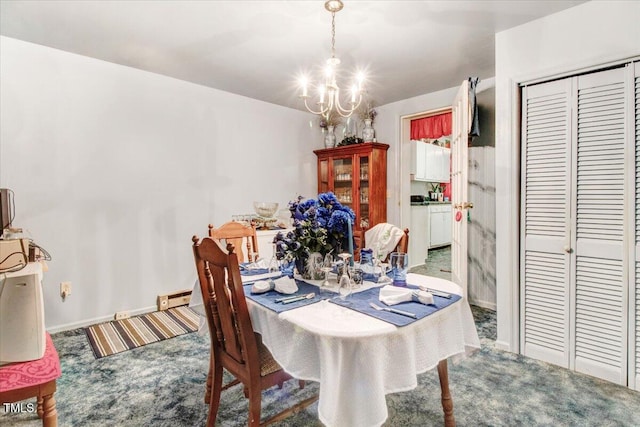320 Dead End Rd, Enfield, NC 27823 - dining room featuring carpet, a chandelier, and a baseboard radiator