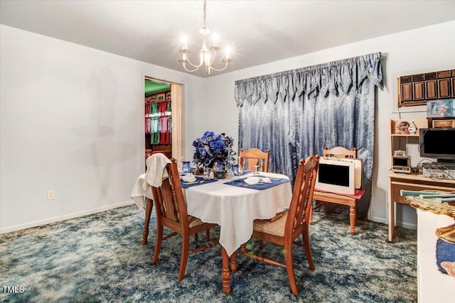 320 Dead End Rd, Enfield, NC 27823 - carpeted dining area featuring a chandelier and baseboards