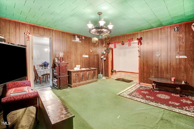 320 Dead End Rd, Enfield, NC 27823 - carpeted living area featuring wooden walls and a chandelier