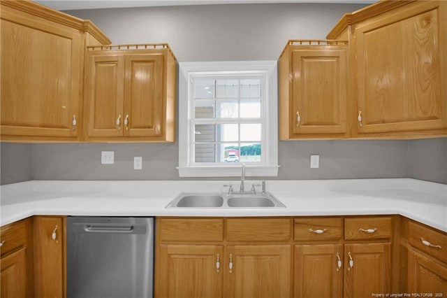 kitchen with a sink, light countertops, and dishwasher