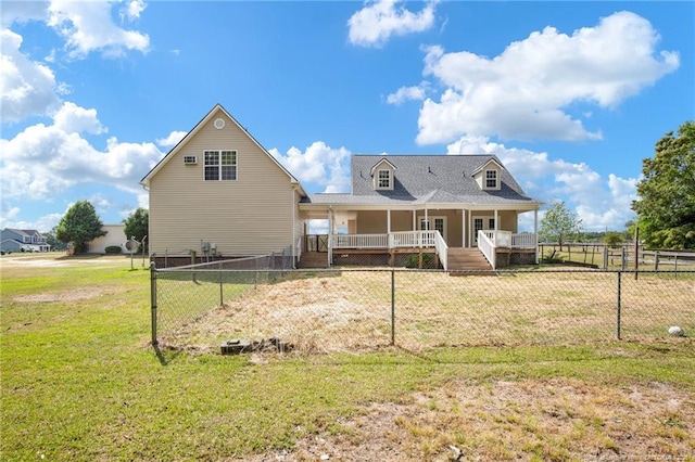 rear view of house with a yard, a fenced backyard, and a porch