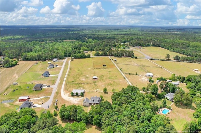 aerial view with a rural view and a view of trees