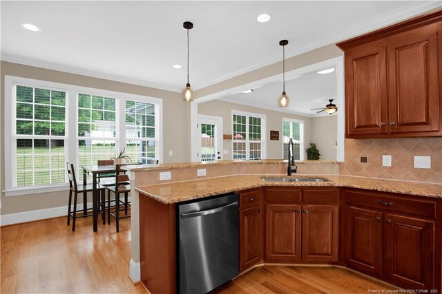 kitchen with stainless steel dishwasher, a sink, brown cabinets, decorative backsplash, and ornamental molding