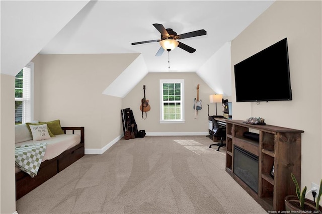 carpeted office with plenty of natural light, baseboards, ceiling fan, and lofted ceiling