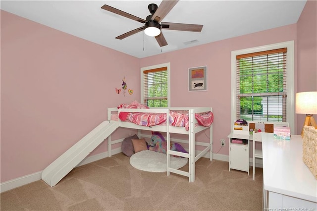 bedroom with carpet, baseboards, and ceiling fan
