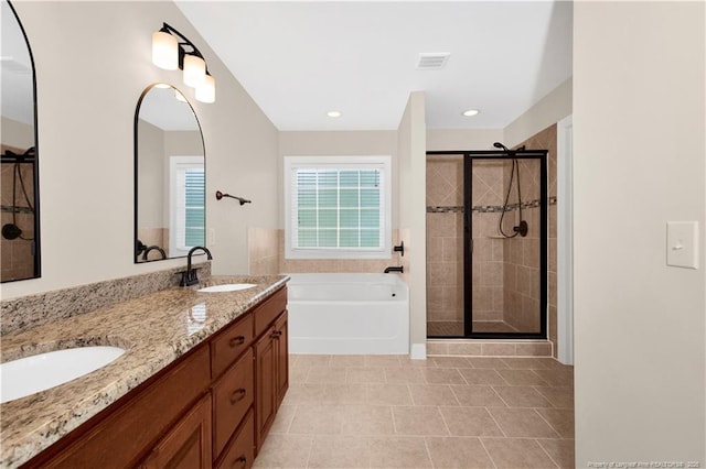 full bath featuring a stall shower, tile patterned floors, a bath, double vanity, and recessed lighting