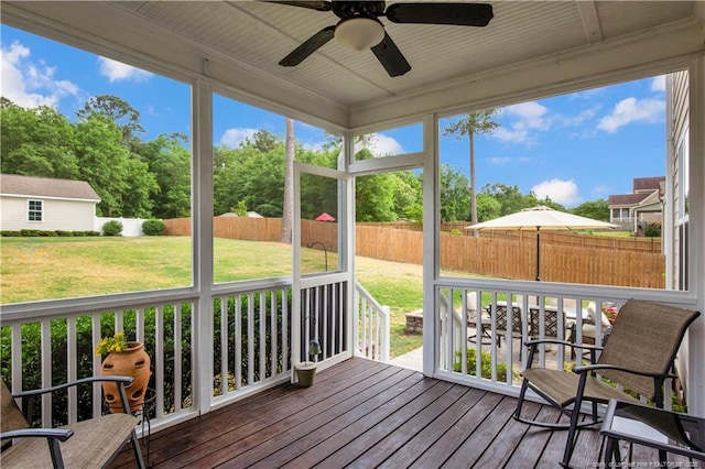 sunroom with ceiling fan and healthy amount of natural light
