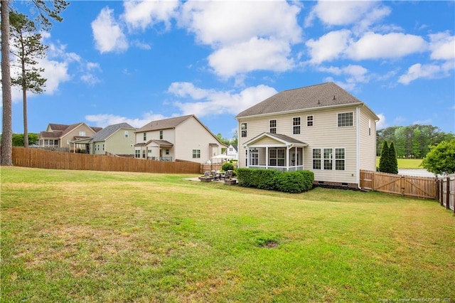 back of property featuring crawl space, a residential view, and a sunroom