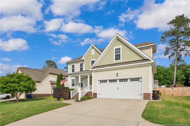 view of front facade featuring a porch, driveway, and a garage