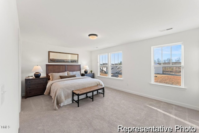 bedroom with carpet, baseboards, and visible vents