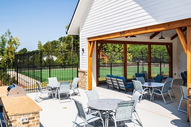 2000 Clydner Dr, Apex, NC 27523 - view of patio featuring outdoor dining area, fence, and ceiling fan