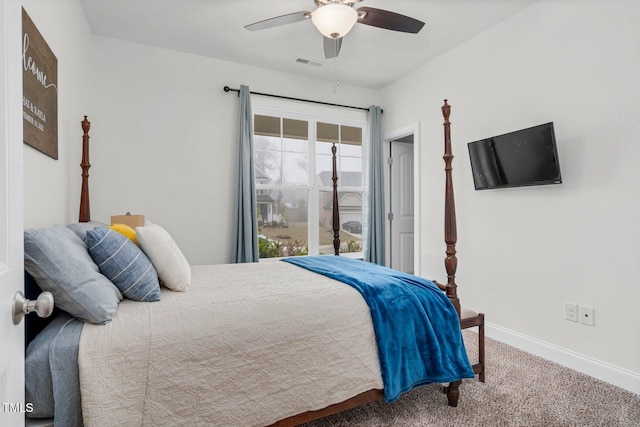 carpeted bedroom featuring baseboards and ceiling fan